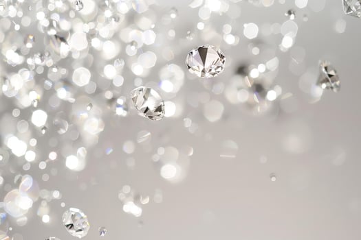 Dazzling diamond-like sparkles sparkling against a transparent white backdrop, adding a touch of luxury and allure photo