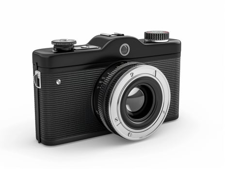 Sleek black camera isolated on white photo