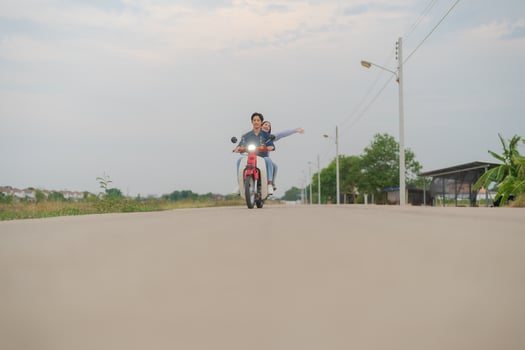 Joyful couple on motorcycle adventure photo