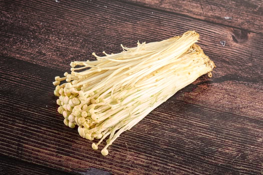 Tasty raw enoki mushroom heap photo