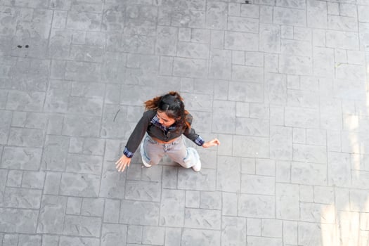 Asian women do freestyle hip hop and breakdancing in a public space in the middle of the city. With a cheerful and happy attitude photo