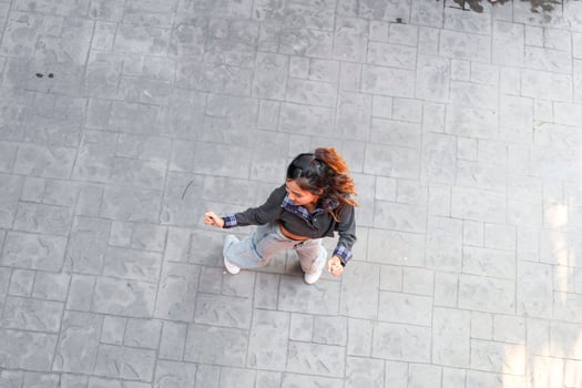 Asian women do freestyle hip hop and breakdancing in a public space in the middle of the city. With a cheerful and happy attitude photo