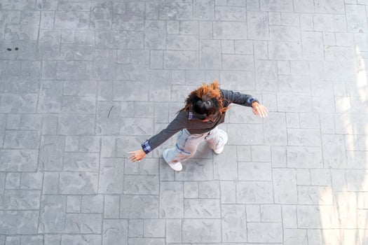 Asian women do freestyle hip hop and breakdancing in a public space in the middle of the city. With a cheerful and happy attitude photo