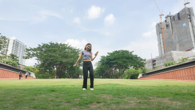 Asian women do freestyle hip hop and breakdancing in a public space in the middle of the city. With a cheerful and happy attitude photo
