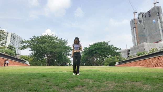 Asian women do freestyle hip hop and breakdancing in a public space in the middle of the city. With a cheerful and happy attitude photo