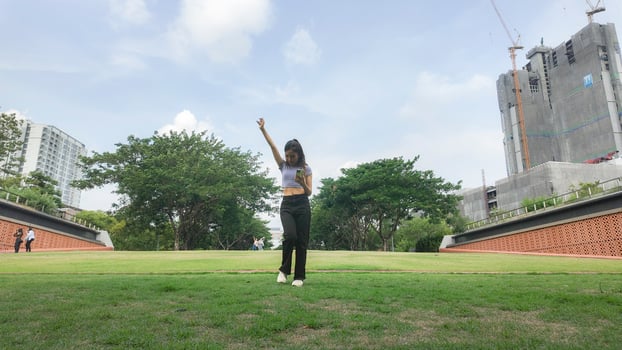 Asian women do freestyle hip hop and breakdancing in a public space in the middle of the city. With a cheerful and happy attitude photo
