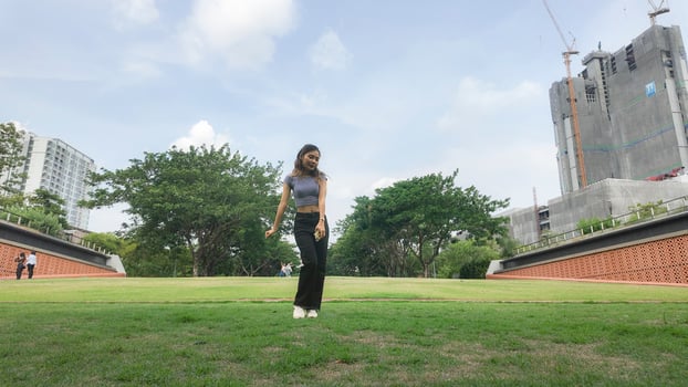 Asian women do freestyle hip hop and breakdancing in a public space in the middle of the city. With a cheerful and happy attitude photo