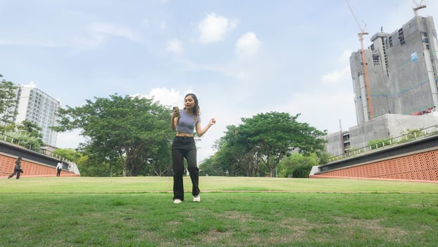 Asian women do freestyle hip hop and breakdancing in a public space in the middle of the city. With a cheerful and happy attitude photo