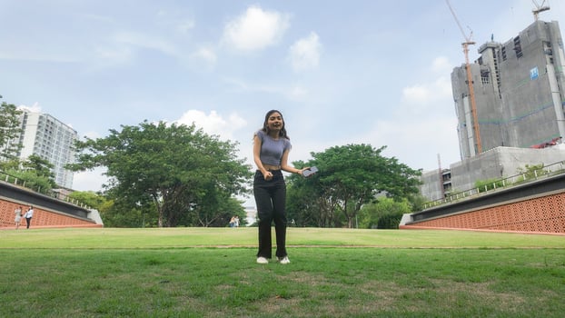 Asian women do freestyle hip hop and breakdancing in a public space in the middle of the city. With a cheerful and happy attitude photo