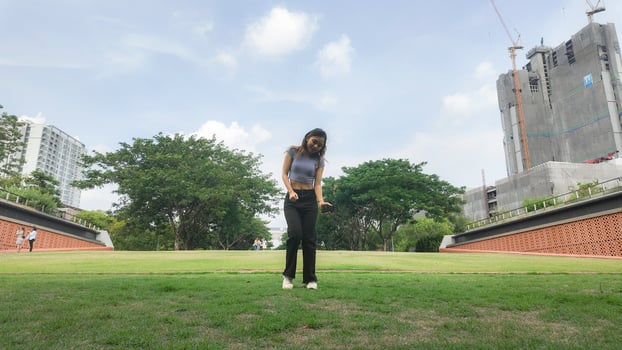 Asian women do freestyle hip hop and breakdancing in a public space in the middle of the city. With a cheerful and happy attitude photo