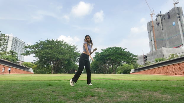 Asian women do freestyle hip hop and breakdancing in a public space in the middle of the city. With a cheerful and happy attitude photo