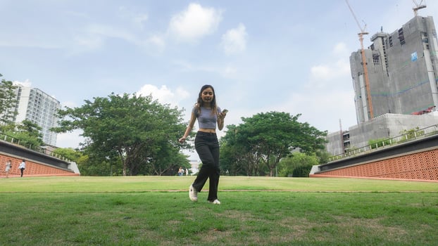 Asian women do freestyle hip hop and breakdancing in a public space in the middle of the city. With a cheerful and happy attitude photo