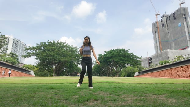 Asian women do freestyle hip hop and breakdancing in a public space in the middle of the city. With a cheerful and happy attitude photo