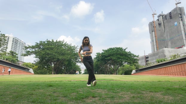 Asian women do freestyle hip hop and breakdancing in a public space in the middle of the city. With a cheerful and happy attitude photo