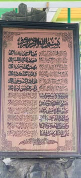 a display board that says Arabic sholawat photo