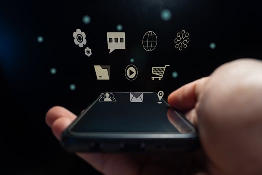 Hand holding a smart phone with virtual digital icon photo