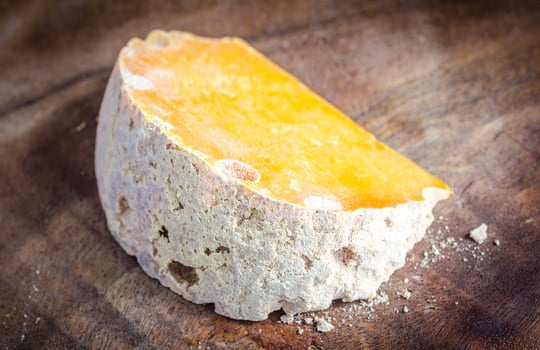 Mimolette cheese wedge photo