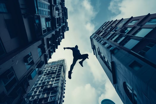 Parkour mid-air urban gap jump photo