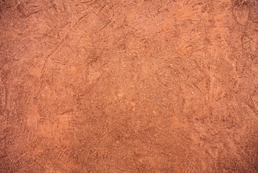 Red Sandy Surface Imprinted with Shoe Tracks, Texture Background photo