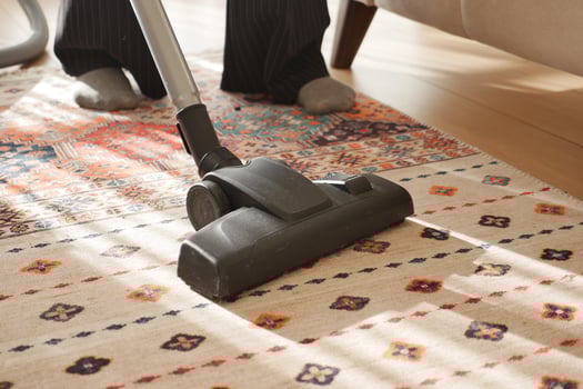 women cleaning with vacuum cleaner carpet, photo
