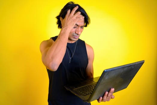 Man lose stock shares hand on head photo