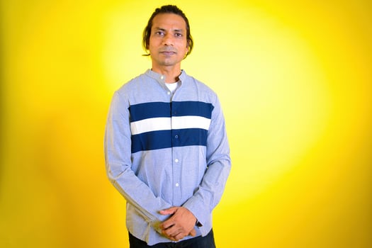 Portrait of young smiling man standing photo