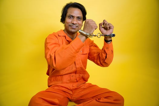 Male prisoner sitting on floor photo