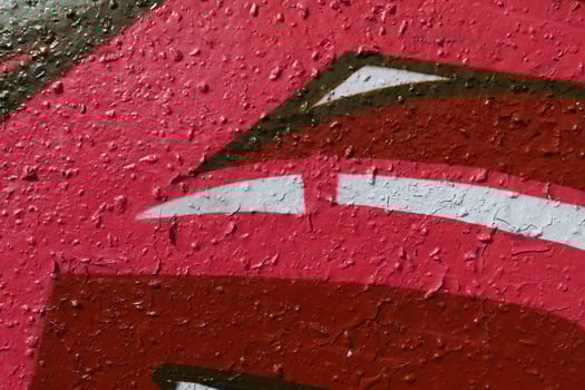Red Weathered Graffiti Wall. Urban Street Art Beauty. Texture Ba photo