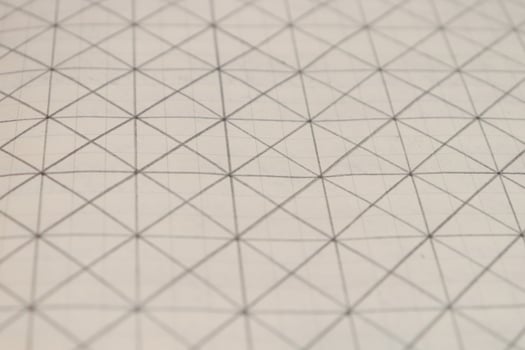 Pencil drawn grid on a notebook sheet. Flat drawn lines. photo
