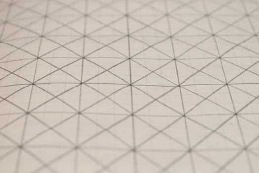 Pencil drawn grid on a notebook sheet. Flat drawn lines. photo