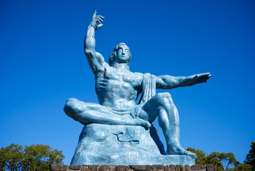 Nagasaki, Japan - December 8, 2023 - The Peace Statue at Nagasaki Peace Park, Nagasaki Peace Statue is built on commission to commemorate the atomic bombing of the city on August 9, 1945 during WWII photo