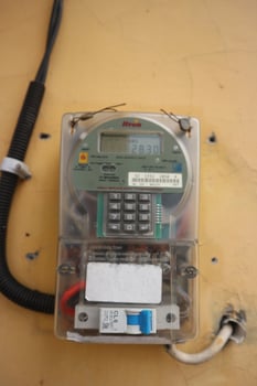 Close-up of electric meter with digital readings photo