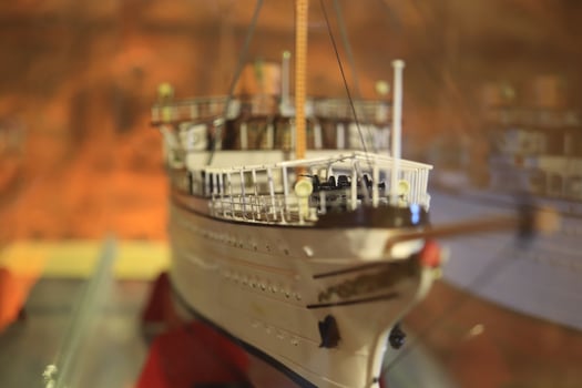 Scaly ship model. White boat layout. Macro closeup. photo