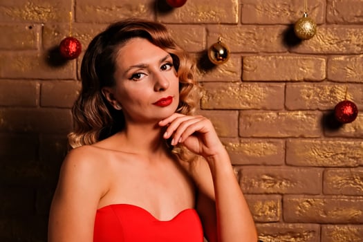 the girl received a gift. girl in a red dress. holiday gift. photo