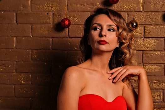 the girl received a gift. girl in a red dress. holiday gift. photo