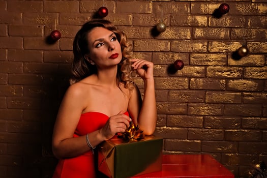 the girl received a gift. girl in a red dress. holiday gift. photo