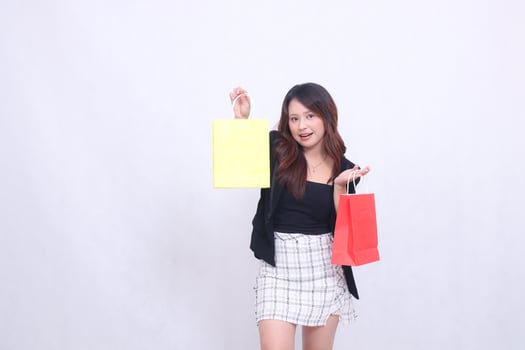 beautiful customer, girl woman, 20s, formal office, elegant, surprised, relaxed, gets a bonus, tote shopping, colorful paper bag, up and down on the shoulder, isolated on a white background photo