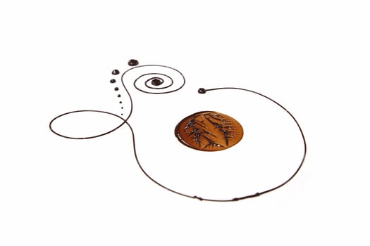 decorative designs made with chocolate on a white background photo