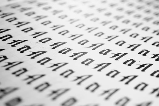 Handwriting black and white symbol filling pattern. Calligraphic letter A learning skills paper page. Calligraphy letters A background. Lettering practice writing worksheet. photo