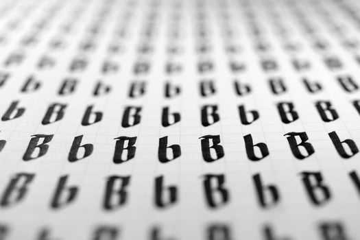 Calligraphy black and white letters B background. Lettering practice writing worksheet. Handwriting symbol filling pattern. Calligraphic letter B learning skills paper page. photo