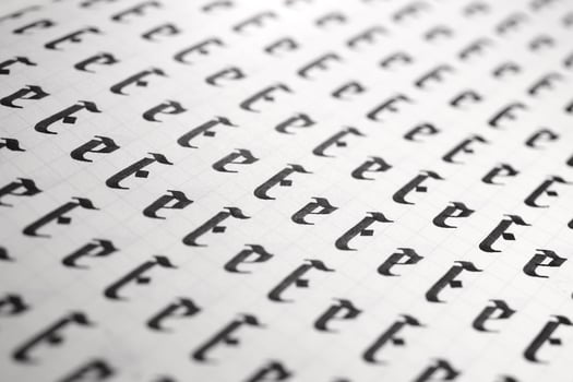 Handwriting black and white symbol filling pattern. Calligraphic letter E learning skills paper page. Calligraphy letters E background. Lettering practice writing worksheet. photo
