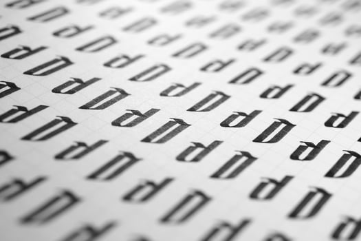 Handwriting black and white symbol filling pattern. Calligraphic letter D learning skills paper page. Calligraphy letters D background. Lettering practice writing worksheet. photo