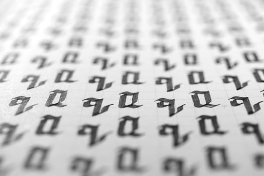 Handwriting black and white symbol filling pattern. Calligraphic letter Q learning skills paper page. Calligraphy letters q background. Lettering practice writing worksheet. photo