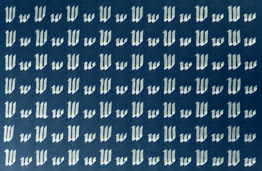 Lettering white on dark blue practice writing worksheet. Handwriting symbol filling pattern. Calligraphic letter W learning skills paper page. Calligraphy letters w background. photo