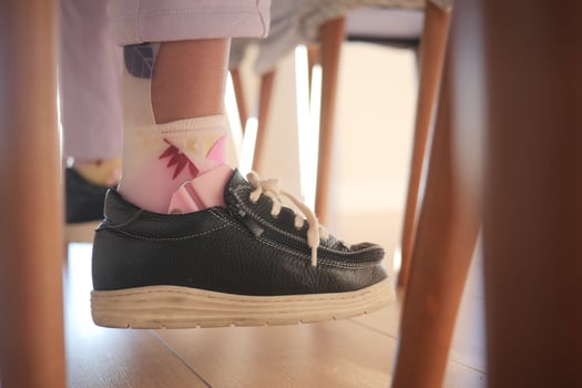 Child cerebral palsy disability, legs orthosis. photo