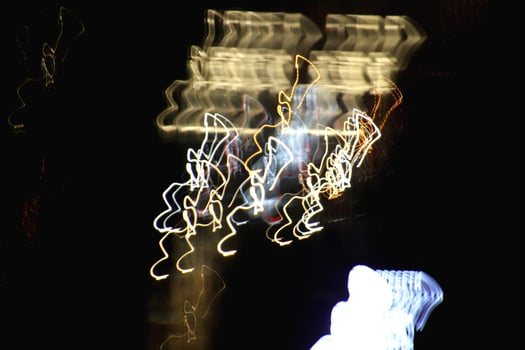 Night exposure shake traces background. Light lines leaks exposition backdrop. Night city rays glow texture. photo