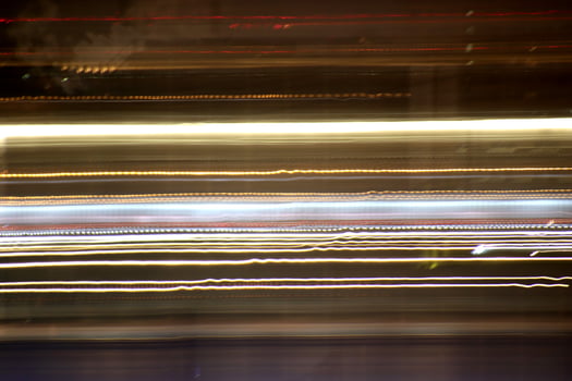 Light lines leaks exposition background. Night city rays glow backdrop. Night exposure zoom traces texture. photo