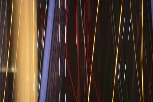Light lines leaks exposition background. Night city rays glow backdrop. Night exposure zoom traces texture. photo