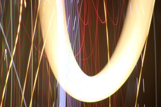 Night exposure zoom traces background. Light lines leaks exposition backdrop. Night city rays glow. photo