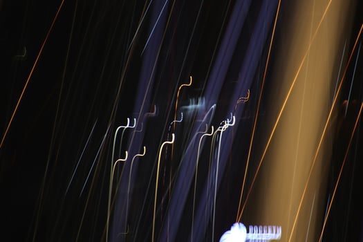 Light lines leaks exposition background. Night city rays glow backdrop. Night exposure zoom traces texture. photo